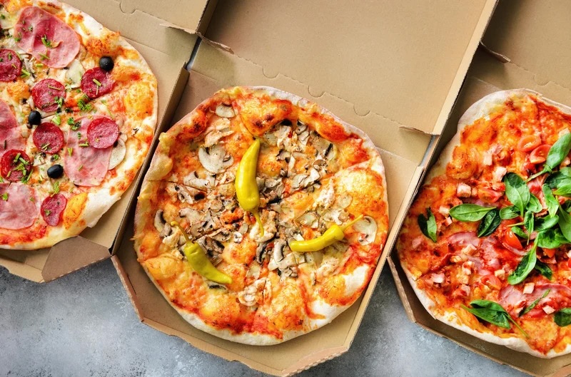 Pizzas in boxes